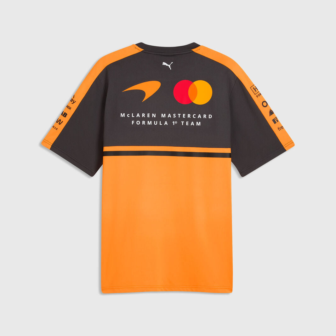Black and orange sports jersey with branding on a light gray background