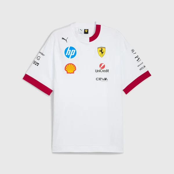 A white Puma Scuderia Ferrari short-sleeve jersey with red collar and cuff trim, featuring multiple sponsor logos including HP, Ferrari, Shell, and Unipart on the front, displayed against a light gray background.