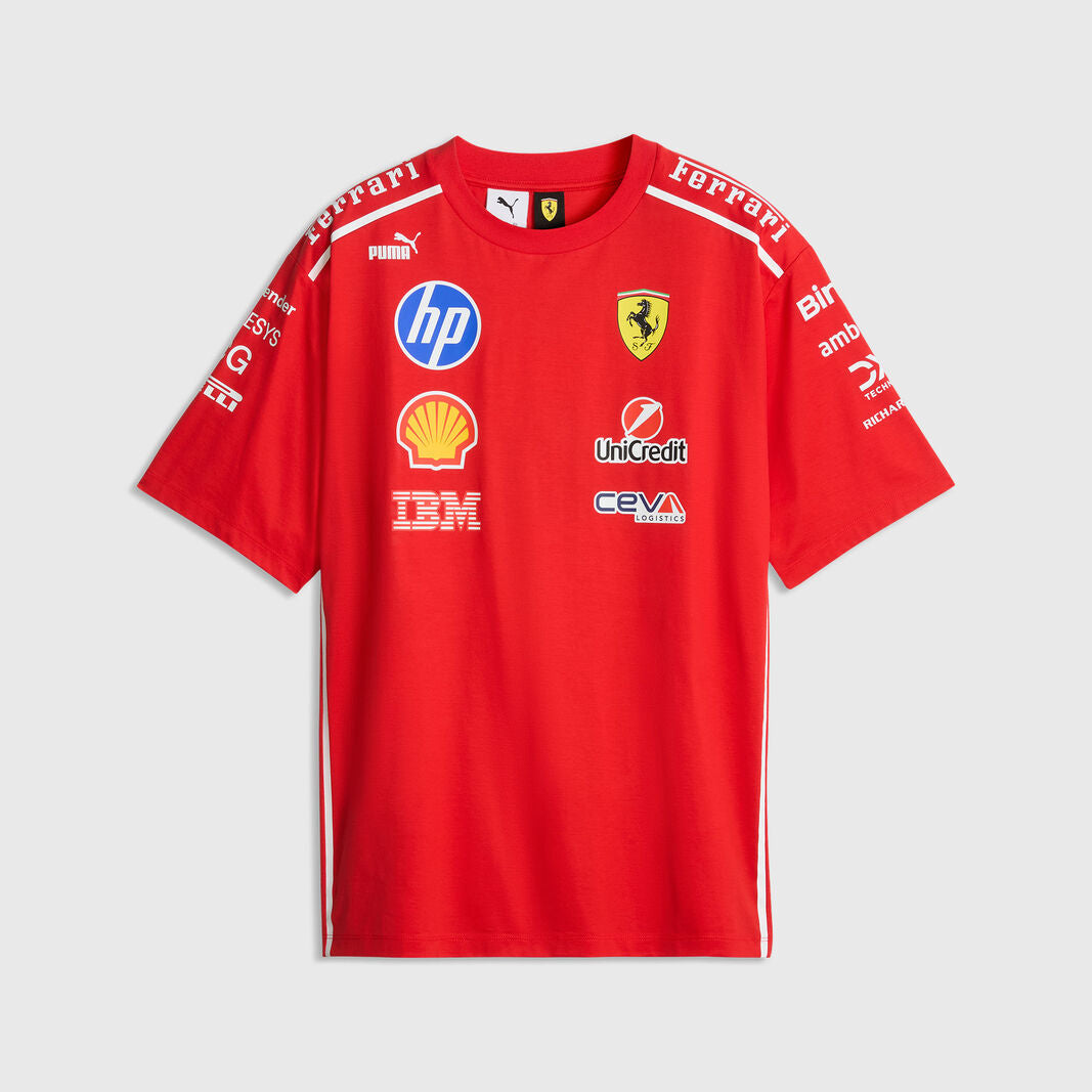 A red short-sleeve Scuderia Ferrari T-shirt with various sponsor logos including HP, Shell, and IBM, displayed on a light gray background.