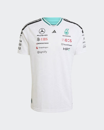 A white Mercedes Petronas Formula 1 team jersey with black and light blue accents, featuring various sponsor logos and the Mercedes star logo on a light gray background.