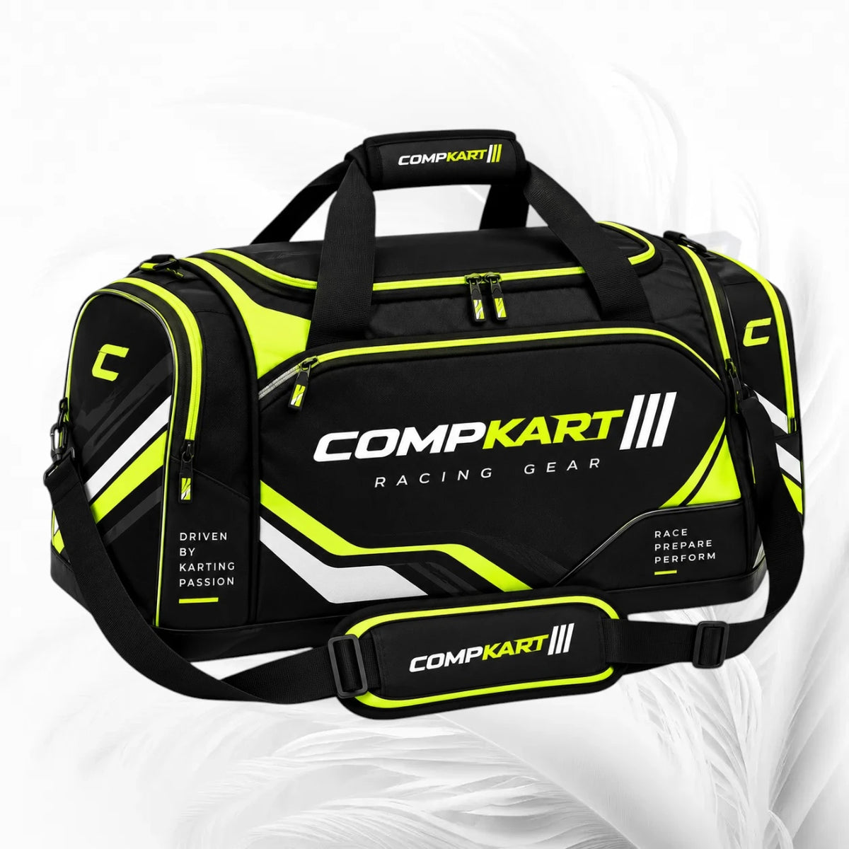 Black and neon yellow CompKart racing duffel bag with white and yellow branding, shown on a light gray background.