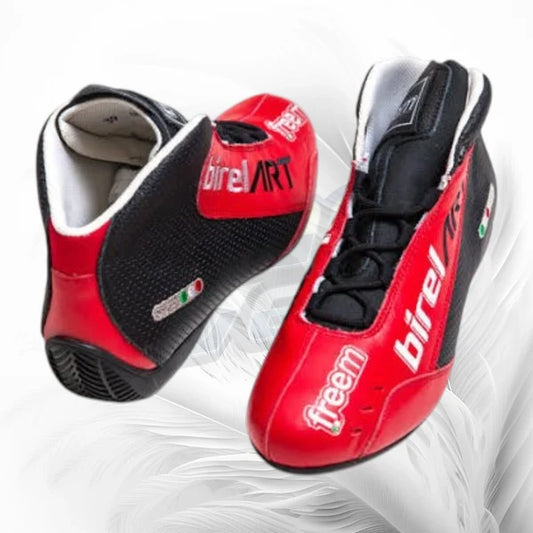 Red and black racing shoes with 'Birel Art' branding on a white background