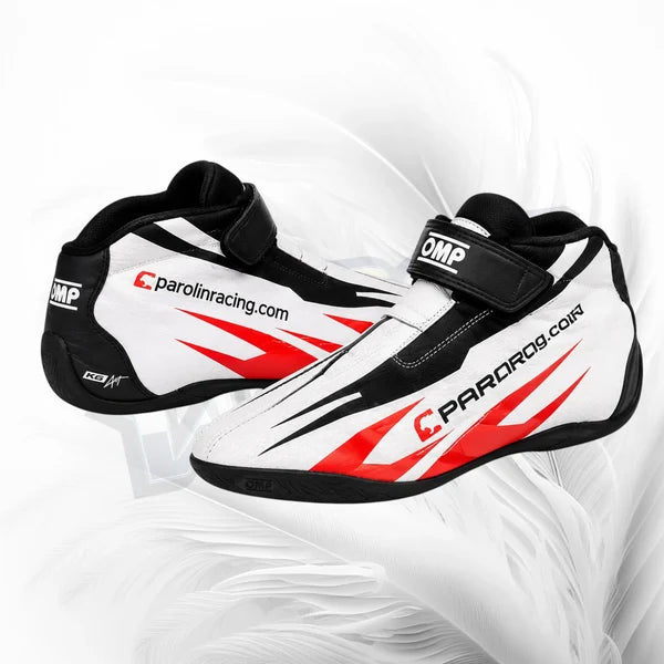 White racing boots with red and black accents on a white background