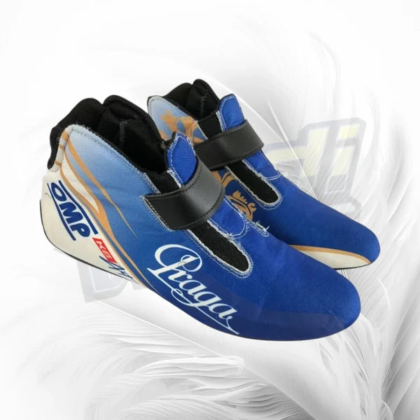 Blue racing shoes with black straps on a white background